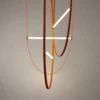 Athos sculptural LED chandelier with orange leather and white acrylic light elements