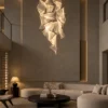 Auretta chrome sculptural LED chandelier illuminating a modern living room