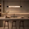 Bahari Gun Black linear chandelier above a contemporary kitchen island