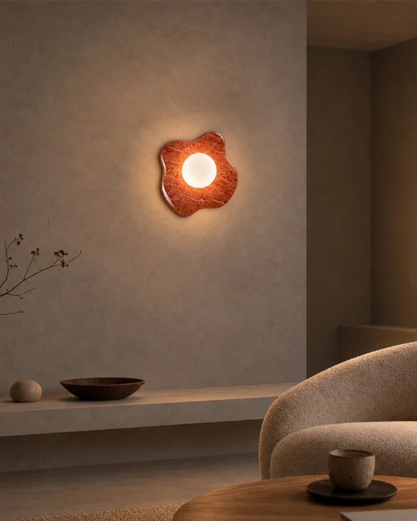 Calissa Coral Red sculptural wall lamp providing warm illumination in a modern interior