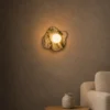 Calissa Irish Green wall lamp providing warm illumination in a contemporary interior