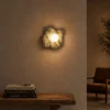Calissa Irish Green sculptural wall lamp illuminating a modern interior