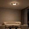 Cara copper LED ceiling lamp in a modern living room interior