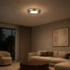 Cara copper LED ceiling lamp illuminating a contemporary living room