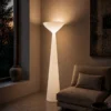 Chalice white floor lamp providing ambient lighting in a modern living room
