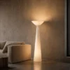 Chalice white sculptural floor lamp illuminating a contemporary interior