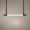 Clio modern linear chandelier in coffee finish with a slim illuminated bar