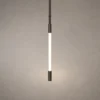 Clio Vertical chandelier with a slim illuminated design in brown and pearl black