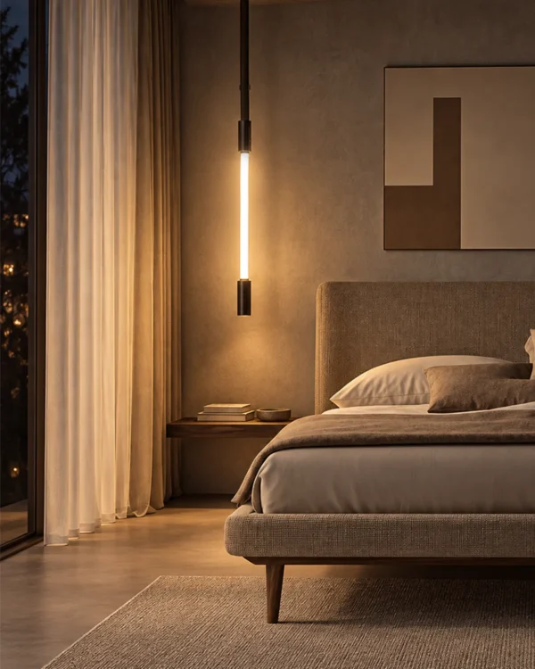 Clio Vertical brown and pearl black chandelier providing warm illumination beside a modern bedroom