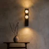 Double Sphere dark brown wall lamp illuminating a modern interior
