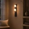 Double Sphere wall lamp with two illuminated spheres in a contemporary interior