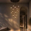 Esadora 15-light coffee and cognac round chandelier illuminating a contemporary hallway