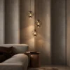 Esadora Large coffee and cognac glass pendant lights in a contemporary living room