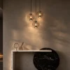 Esadora Large coffee and cognac pendant lights arranged in a modern interior