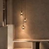 Esadora Medium coffee and cognac pendant lights arranged in a contemporary interior
