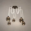 Evadne modern cluster chandelier with smoky glass globes and white suspended cords