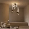 Evadne smoky glass cluster chandelier illuminating a contemporary living room