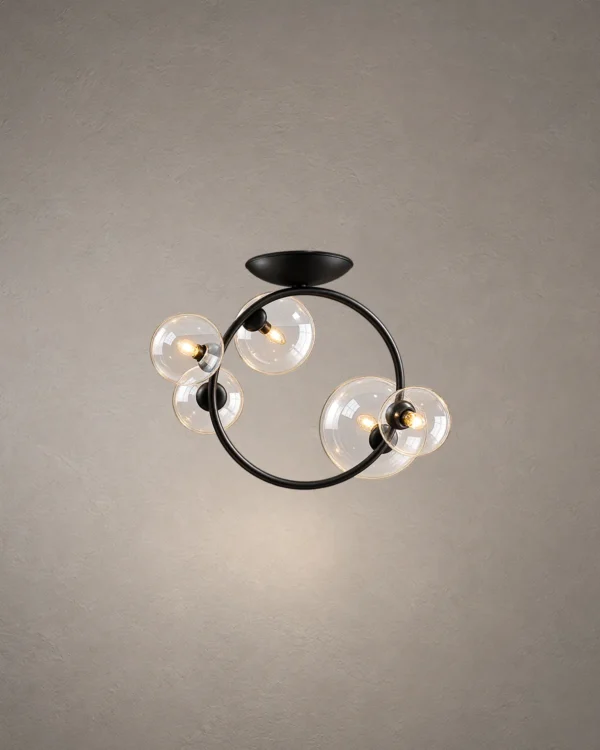 Hebe modern ceiling light with clear glass globes and sculptural iron frame
