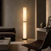 Holden bronze and black floor lamp illuminating a contemporary living room