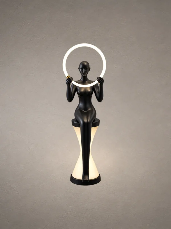 Humano Mirror matte black sculptural floor lamp with illuminated circular light