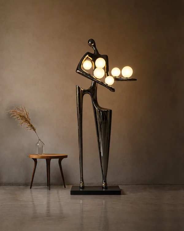 Humano Musician sculptural floor lamp illuminating a modern interior