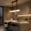 Ianthe dark brown linear chandelier above a contemporary kitchen island