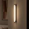 Keaton Gun Black linear wall lamp with a slim illuminated design