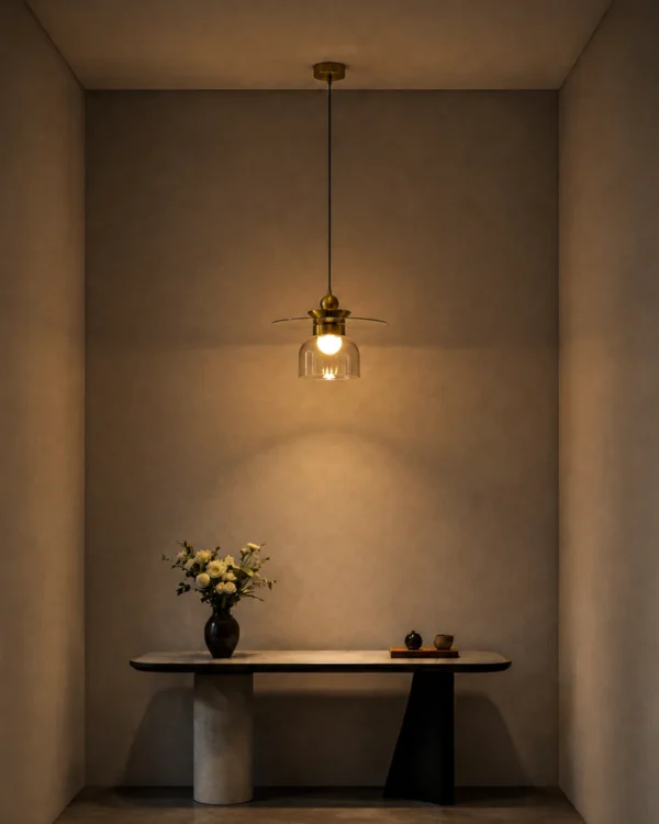 Lara brass gold pendant light illuminating a contemporary interior