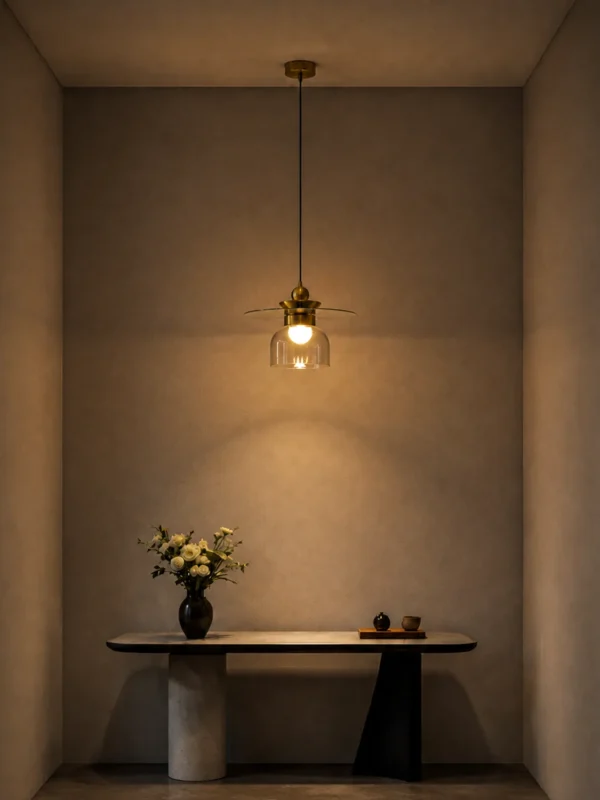 Lara brass gold pendant light illuminating a contemporary interior