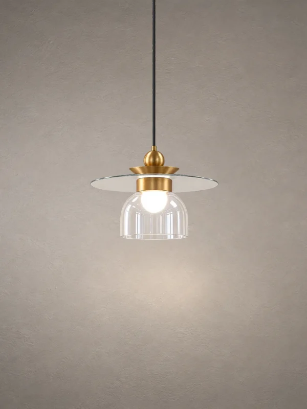 Lara brass gold pendant light with layered circular shade and clear glass element