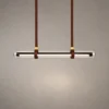Maia brown modern linear chandelier with a slim illuminated horizontal bar