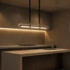 Maia modern linear chandelier above a contemporary kitchen island