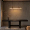 Maia modern linear chandelier illuminating a contemporary dining interior