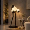 Maravel black sculptural floor lamp illuminating a modern interior