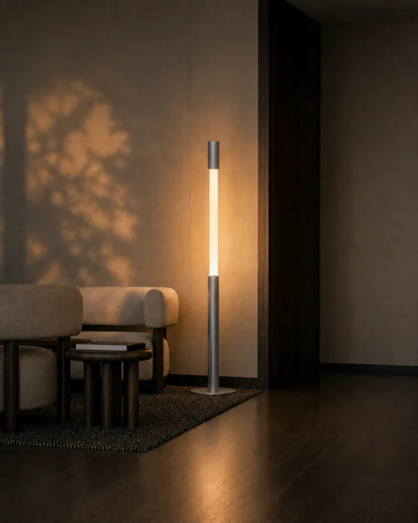 Safiya grey minimalist floor lamp illuminating a contemporary interior