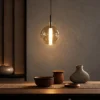 Siris Round amber spherical pendant light in a contemporary interior