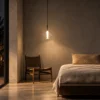 Siris Round clear spherical pendant light illuminating a modern bedroom
