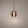 Siris Round copper spherical pendant light with black suspension detail