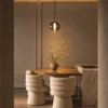 Siris Round smoky grey and black spherical pendant light in a modern interior