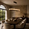Soma Cylindrical chandelier above a contemporary dining table