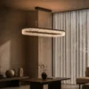 Valor Oval coffee gold chandelier illuminating a modern interior