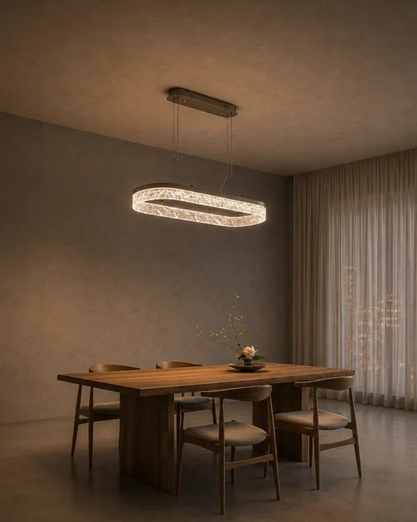 Valor Oval coffee gold chandelier above a contemporary dining table