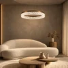 Valor Single coffee gold ring chandelier illuminating a contemporary living room