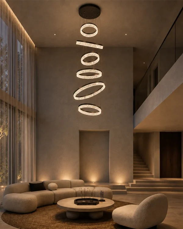 Valor Staircase coffee gold cascading ring chandelier in a high-ceiling living room