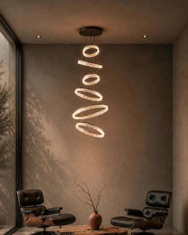 Valor Staircase multi-ring chandelier illuminating a contemporary high-ceiling interior