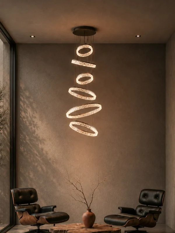 Valor Staircase multi-ring chandelier illuminating a contemporary high-ceiling interior