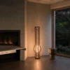 Zora walnut floor lamp providing warm illumination in a contemporary interior