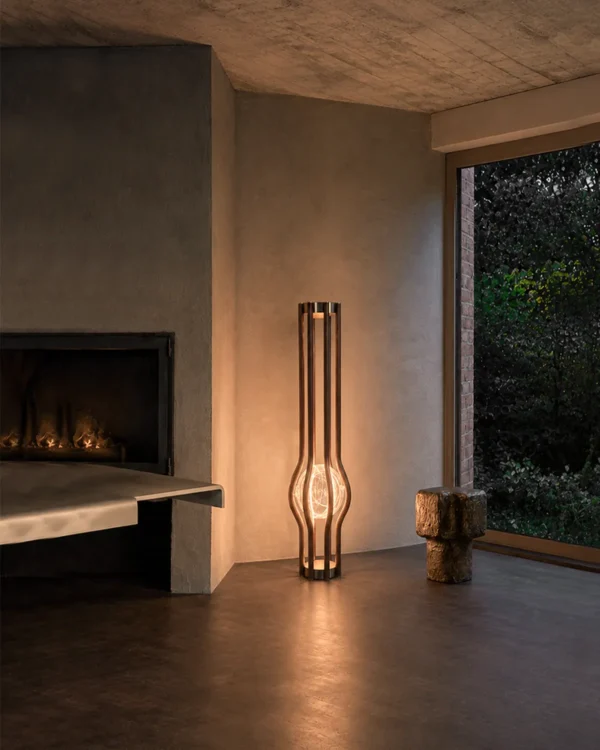 Zora walnut floor lamp providing warm illumination in a contemporary interior