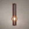 Zora walnut sculptural floor lamp with vertical slatted design and illuminated center