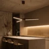 Zoya bronze LED pendant light above a contemporary kitchen island